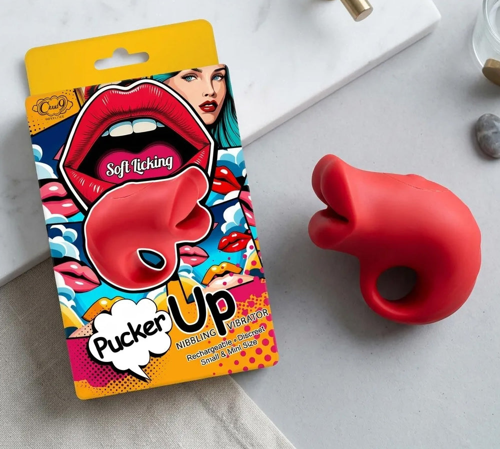 Pucker Up Lips With Ergonomic Finger Hold Vibrator Red in packaging, showcasing its playful lip design and ergonomic hold.