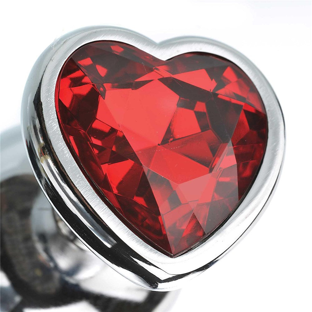 Close-up of the heart-shaped red gem from the Adam & Eve Three Hearts Gem Anal Plug Set.