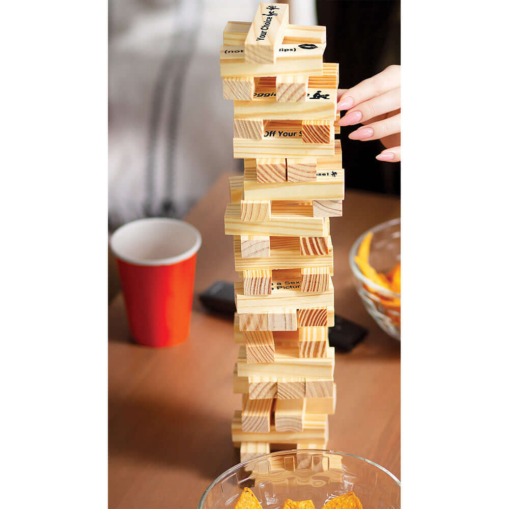 Tower Tease Naughty Sexy Stacking Game displayed with wooden blocks on a table, ready for a fun adult party.