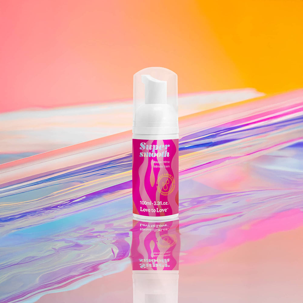 Love To Love Super Smooth Lubricant Foam 3.3 Oz on colorful reflective background