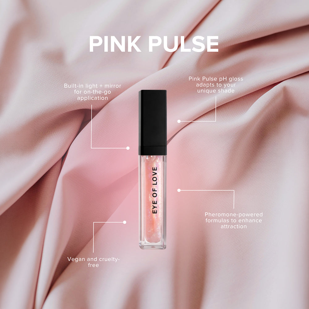 Eye Of Love Matchmaker Pink Pulse Pheromone pH Lip Stain with built-in light and vegan formula on pink fabric.