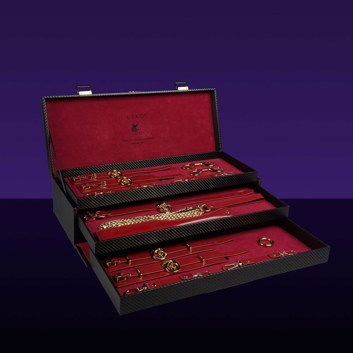 UPKO luxury Italian leather bondage tools set displayed in an elegant red-lined case, showcasing various BDSM accessories.