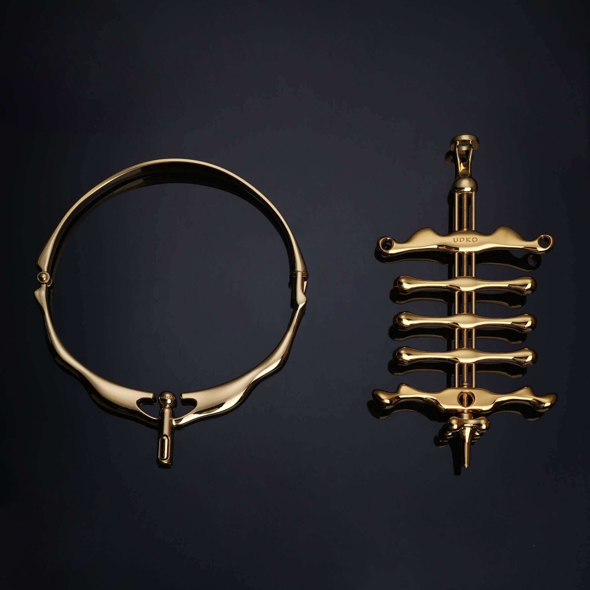 UPKO Migratory Bird metal collar and fingers clamps set in luxurious gold, showcasing elegant design and craftsmanship.