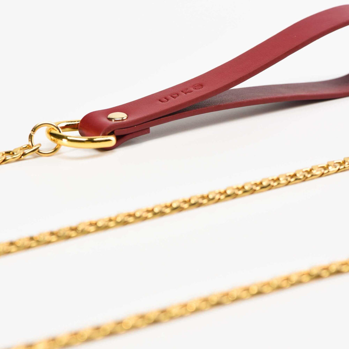 UPKO luxury red leather leash with golden chain, part of the Italian leather bondage tools set for BDSM play.