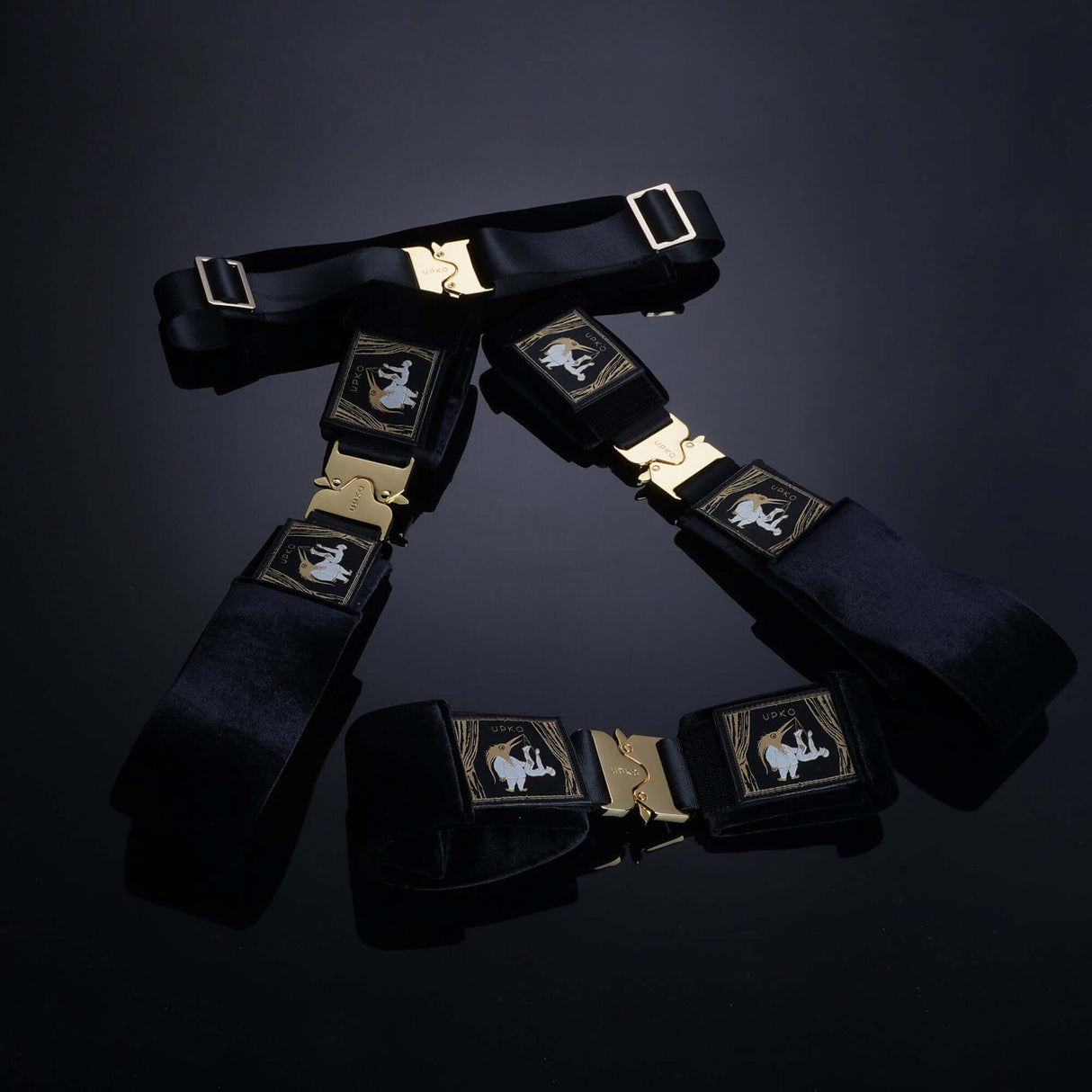 UPKO Clack Bondage Restraints Gear featuring durable black straps and golden buckles for versatile use and secure restraint.