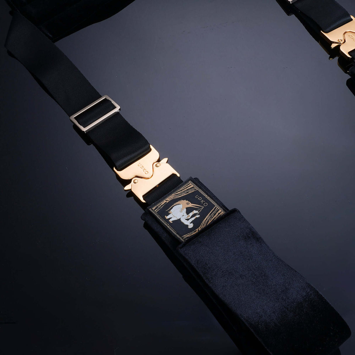 UPKO Clack bondage restraints with gold buckles, featuring durable fabric and dual-sided design for versatile use.