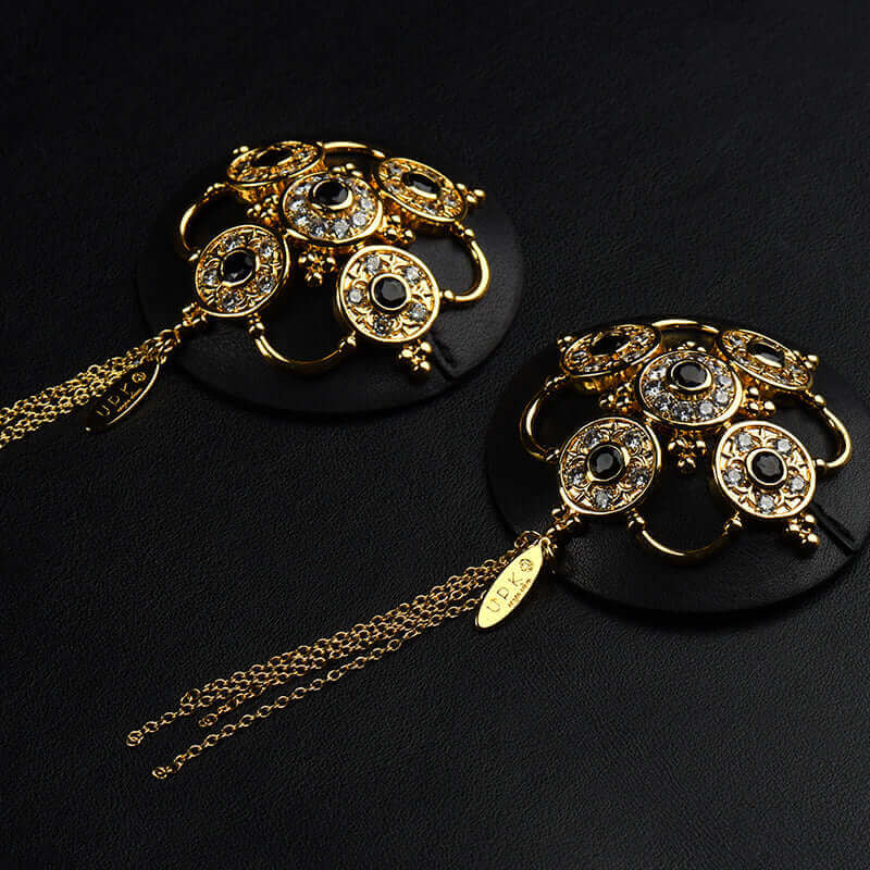 Luxurious Baroque leather nippies with rhinestones, zircon gems, and tassels by UPKO, featuring intricate handcrafted design.
