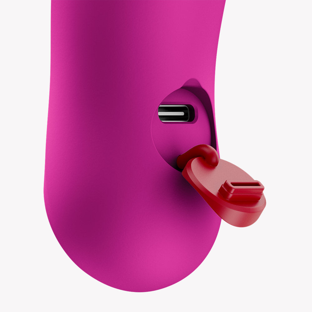 Close-up of Fun Factory Bijou Bullet Vibrator Magenta charging port with protective cap.