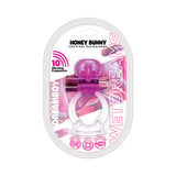 Wet Dreams Honey Bunny Jelly Cock and Ball Sling Magenta in packaging, featuring a bullet and vibrant colors.