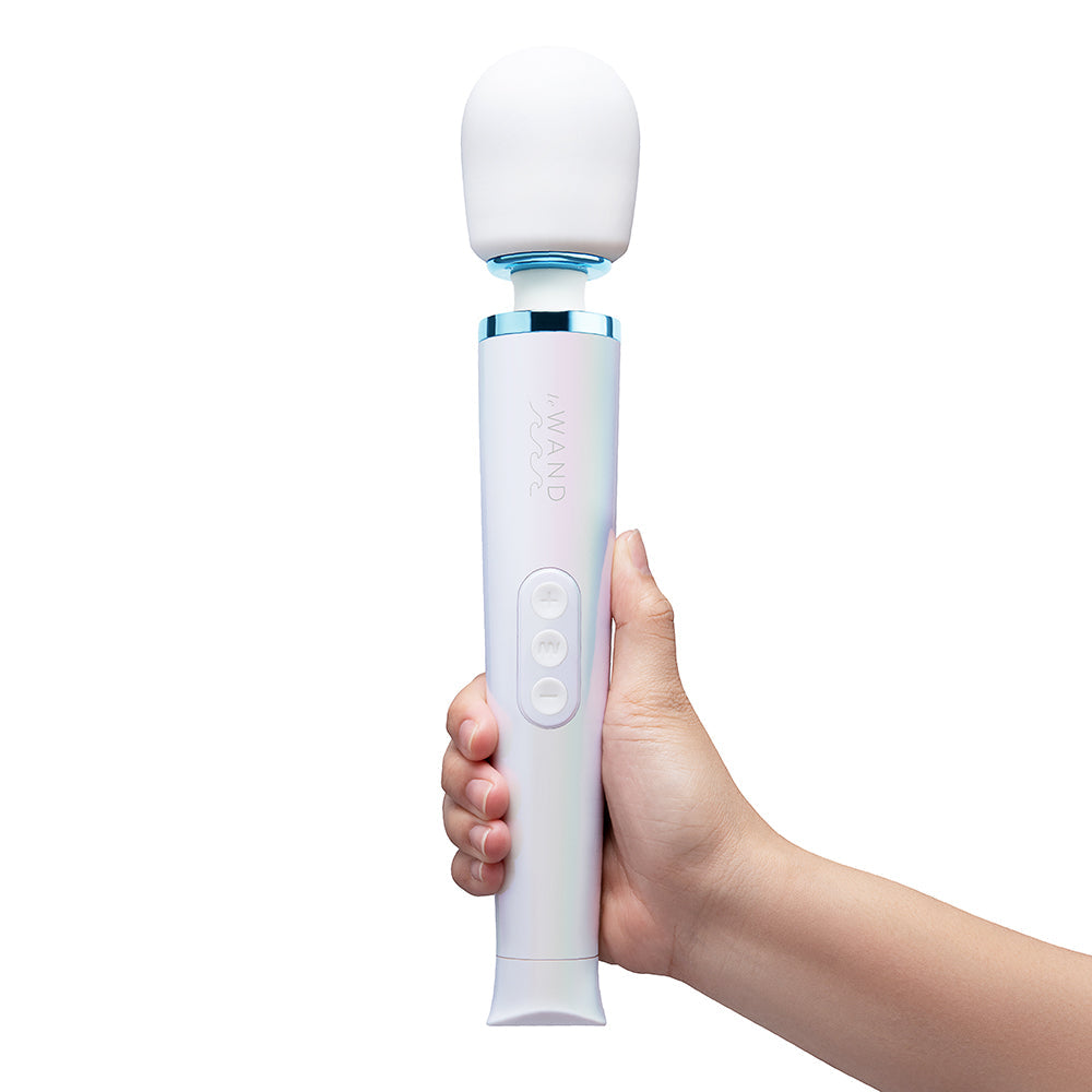 Le Wand Dive Submersible Vibrating Massager Seashell held in hand with sleek design and buttons.