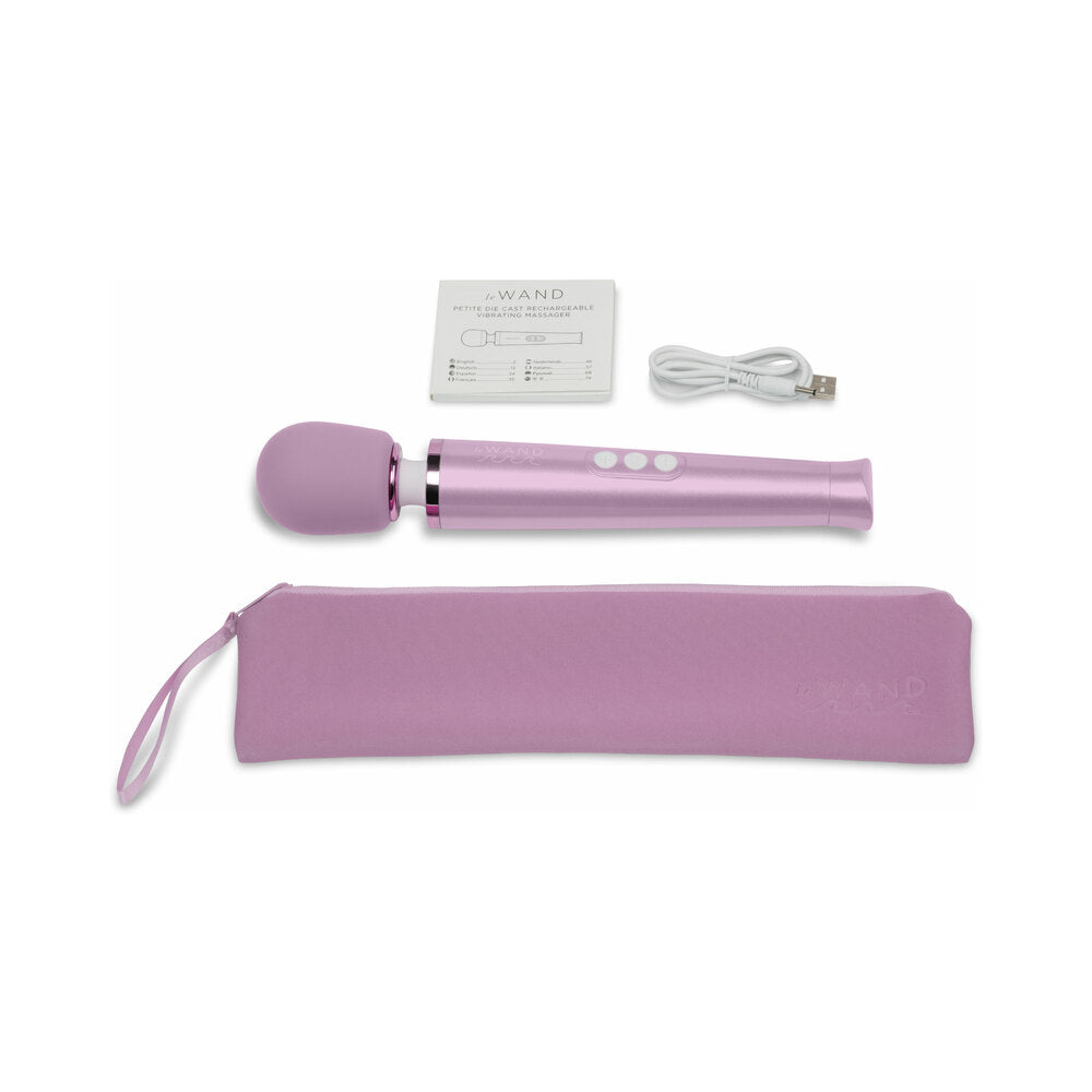 Le Wand Dive Submersible Vibrating Massager Lavender with charging cable and storage pouch.