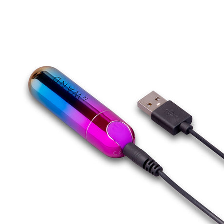 Le Wand Essentials Rechargeable Rainbow Bullet Vibrator connected to a USB charger for easy charging.