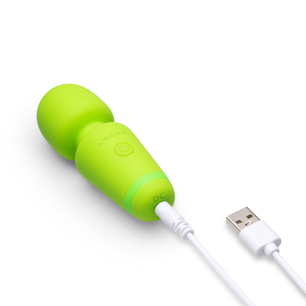 Le Wand Essentials Mini Wand Vibe Pocket-sized Vibrator in vibrant green with USB charging cable