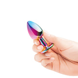 B-vibe Essentials 2-piece Rainbow Bling Anal Training Set in hand, showcasing its colorful design for anal play.