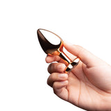 B-vibe Essentials 2-piece Jewel Hearts Anal Training Set held in hand, showcasing its elegant design.