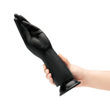 B-vibe Essentials Silicone Hand Fisting Dildo Black being held, showcasing its unique hand shape for deep sensation.