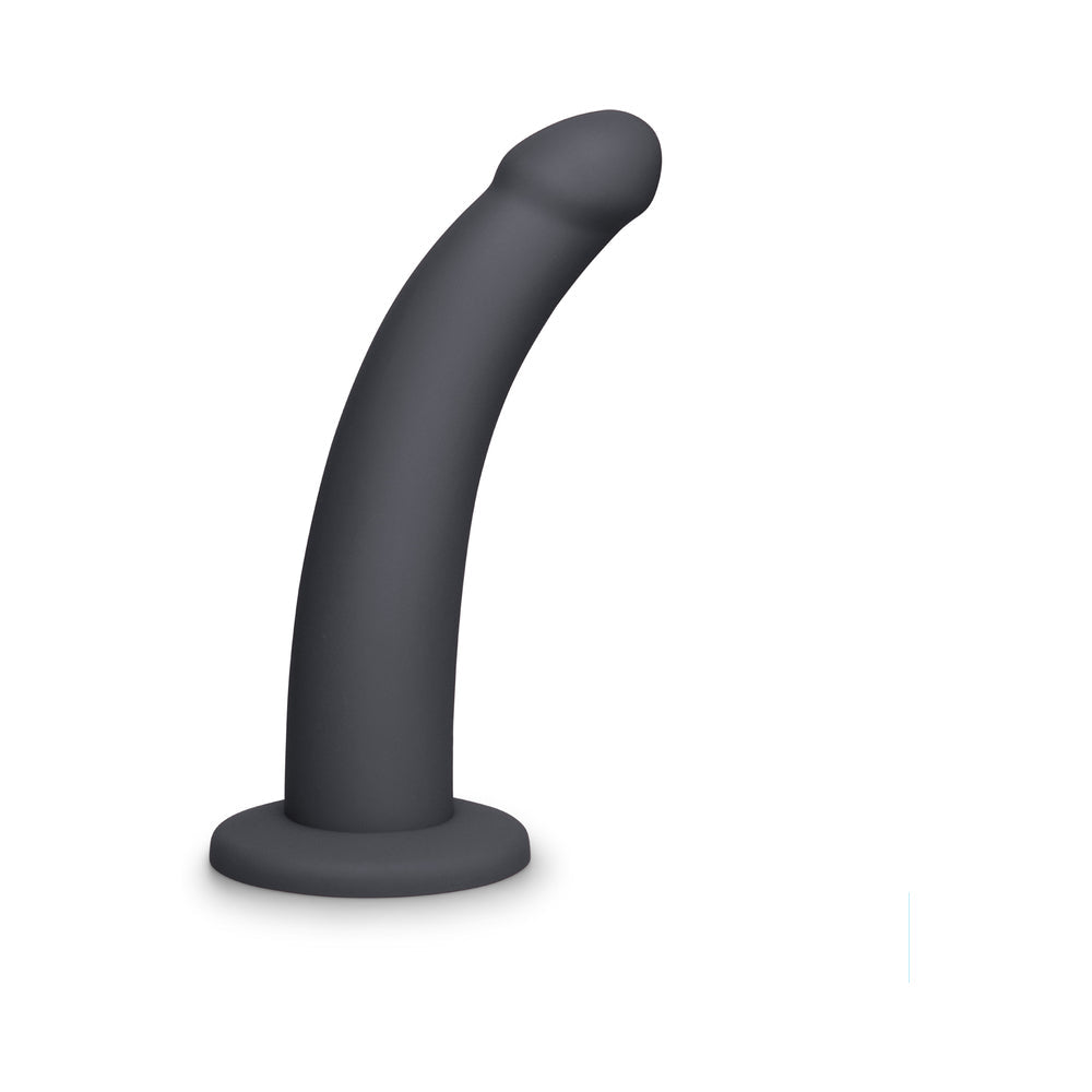 B-vibe Essentials 7 Inch Smooth Silicone Dildo Black in sleek, smooth design for comfort and satisfaction.