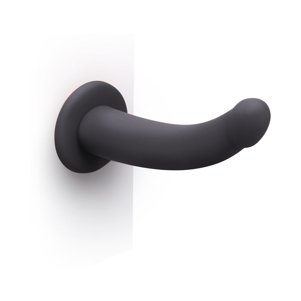 B-vibe Essentials 7 Inch Smooth Silicone Dildo Black with sleek design and smooth surface for comfortable use.