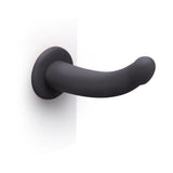 B-vibe Essentials 7 Inch Smooth Silicone Dildo Black with sleek design and smooth surface for comfortable use.