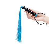 B-vibe Essentials Beaded Flogger featuring a hand holding the item with blue and black design.