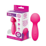 Together Spark On The Go Mini Wand Vibrator in pink packaging, highlighting its compact design and playful features.