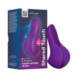 We-Vibe Shared Touch Couples Grinding Vibrator Purple in packaging showcasing its ergonomic design for shared pleasure.