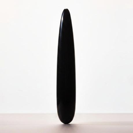 Chakrubs Xaga Slim Non-Phallic Dildo, a sleek black design offering minimalist internal pleasure.