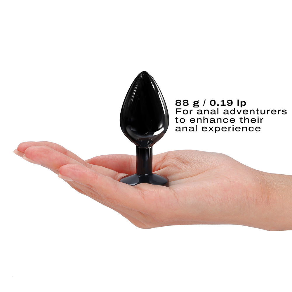 Dorcel Diamond Anal Plug Black Medium held in a hand, designed for anal adventurers seeking enhanced sensations.