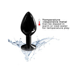 Dorcel Diamond Anal Plug Black Medium shown with water splash and temperature-responsive feature for enhanced sensation.