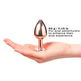 Dorcel Diamond Butt Plug Rose Gold Medium held in hand showcasing its elegant design and medium size for anal play.