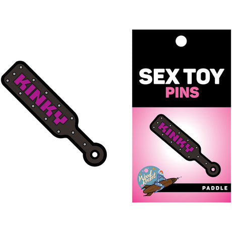 Wood Rocket Kinky Paddle Enamel Lapel Pin Black displayed with packaging on a pink background.
