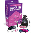 A Lover's Guide To Savoring The Moment Oral Kit displayed with accessories for couples' intimacy and pleasure exploration.