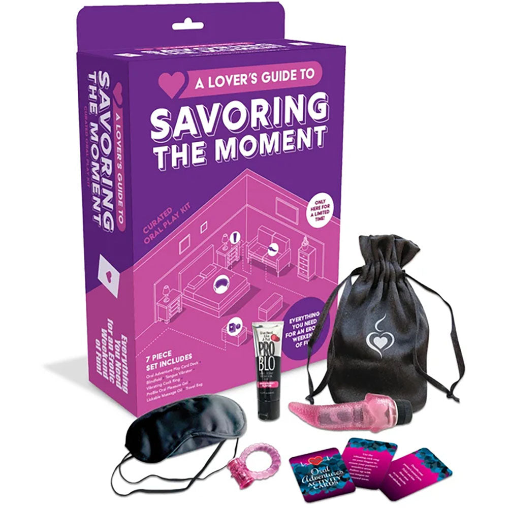 A Lover's Guide To Savoring The Moment Oral Kit displayed with accessories for couples' intimacy and pleasure exploration.