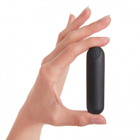 Love To Love Secret Panty 2 Vibrating Panty Black Onyx remote control bullet held in hand.