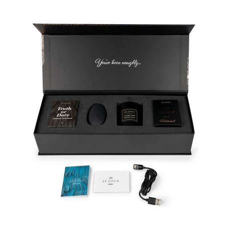 Je Joue The Naughty Collection 4-piece Gift Set displayed in elegant packaging with contents laid out.