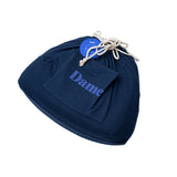 Dame Pillo Sex Position Pillow Indigo with drawstring and pocket detail in navy blue fabric.