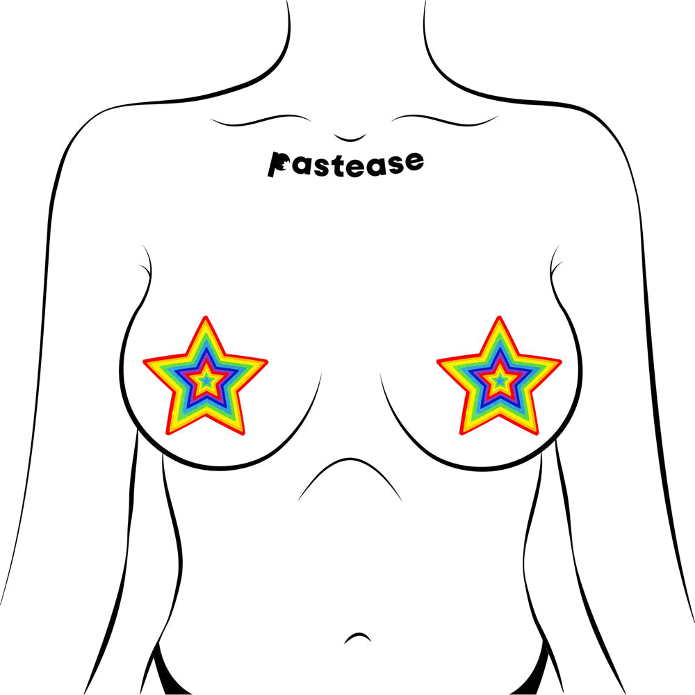 Pastease Glitter Pumping Star Pasties Rainbow on a model, showcasing vibrant rainbow glitter star designs.