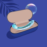 Biird Kalii Glass G-spot Dildo inside a stylish case on a blue background.