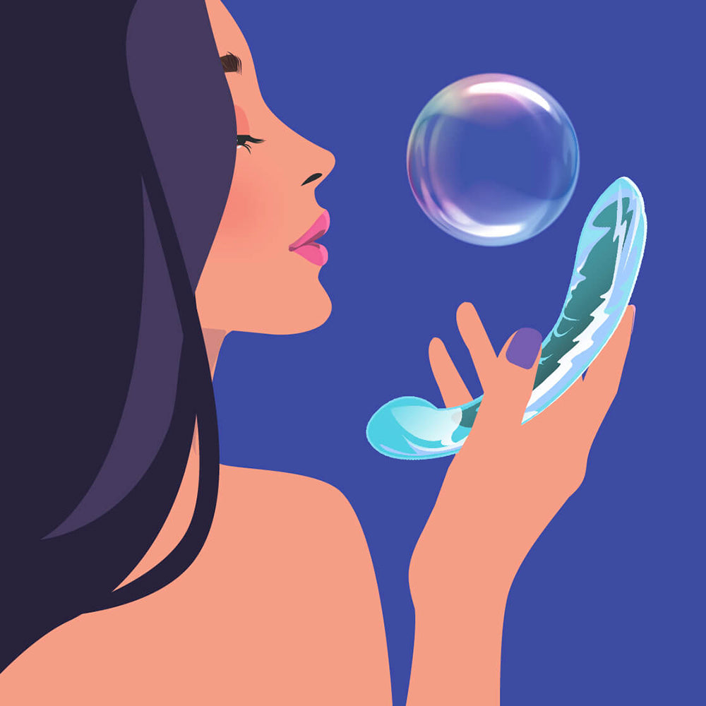 Biird Kalii Glass G-spot Dildo held by a woman, symbolizing elegance and pleasure with a bubble in the background.