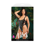 Fantasy Lingerie Vibes Eat Me Mushroom Print Bodysuit S/M on model in tropical setting