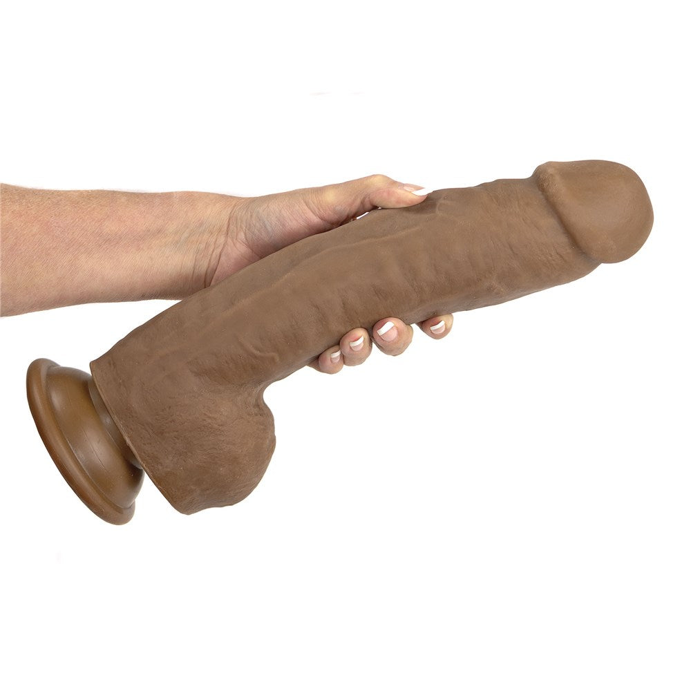 Adam & Eve Adam's Colossal 12 Inch Dildo Brown held in hand showcasing its size and realistic design.