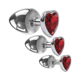 Adam & Eve Three Hearts Gem Anal Plug Set featuring polished aluminum plugs with sparkling red heart-shaped gems.