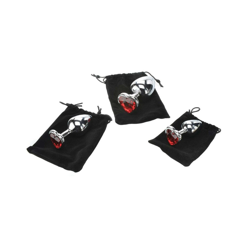 Adam & Eve Three Hearts Gem Anal Plug Set showcased in elegant black pouches with polished aluminum and red gems.
