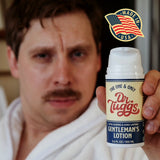 Dr Tuggs Gentleman's Masturbation Lotion 3.4 Oz held by a man in a bathrobe, emphasizing smooth glide and long-lasting performance.