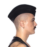Prowler RED Triangle Cap Black Small 55 cm worn at a jaunty angle, showcasing a stylish leather look.