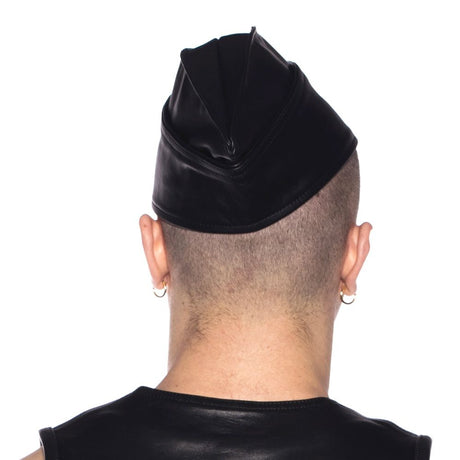 Prowler RED Triangle Cap Black Small 55 cm worn at a jaunty angle, showcasing its unique leather design and classic silhouette.