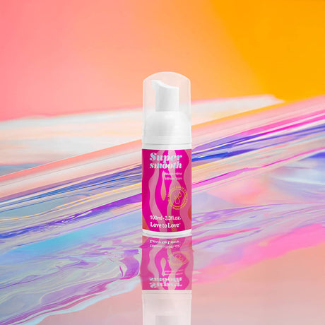 Love To Love Super Smooth Lubricant Foam 3.3 Oz on colorful reflective background