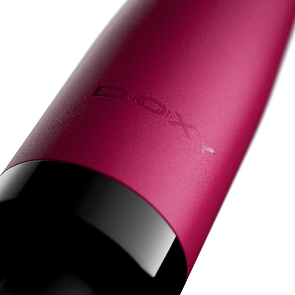 Close-up of the Doxy Original Wand Massager Pink revealing its sleek design and logo.