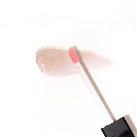 Eye Of Love Matchmaker Pink Pulse Pheromone pH Lip Stain swatch with applicator on a white background.