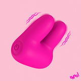 Bang Dual Silicone Clitoral Vibrator Pink on a pink background, showcasing its unique dual tip design and vibrant color.